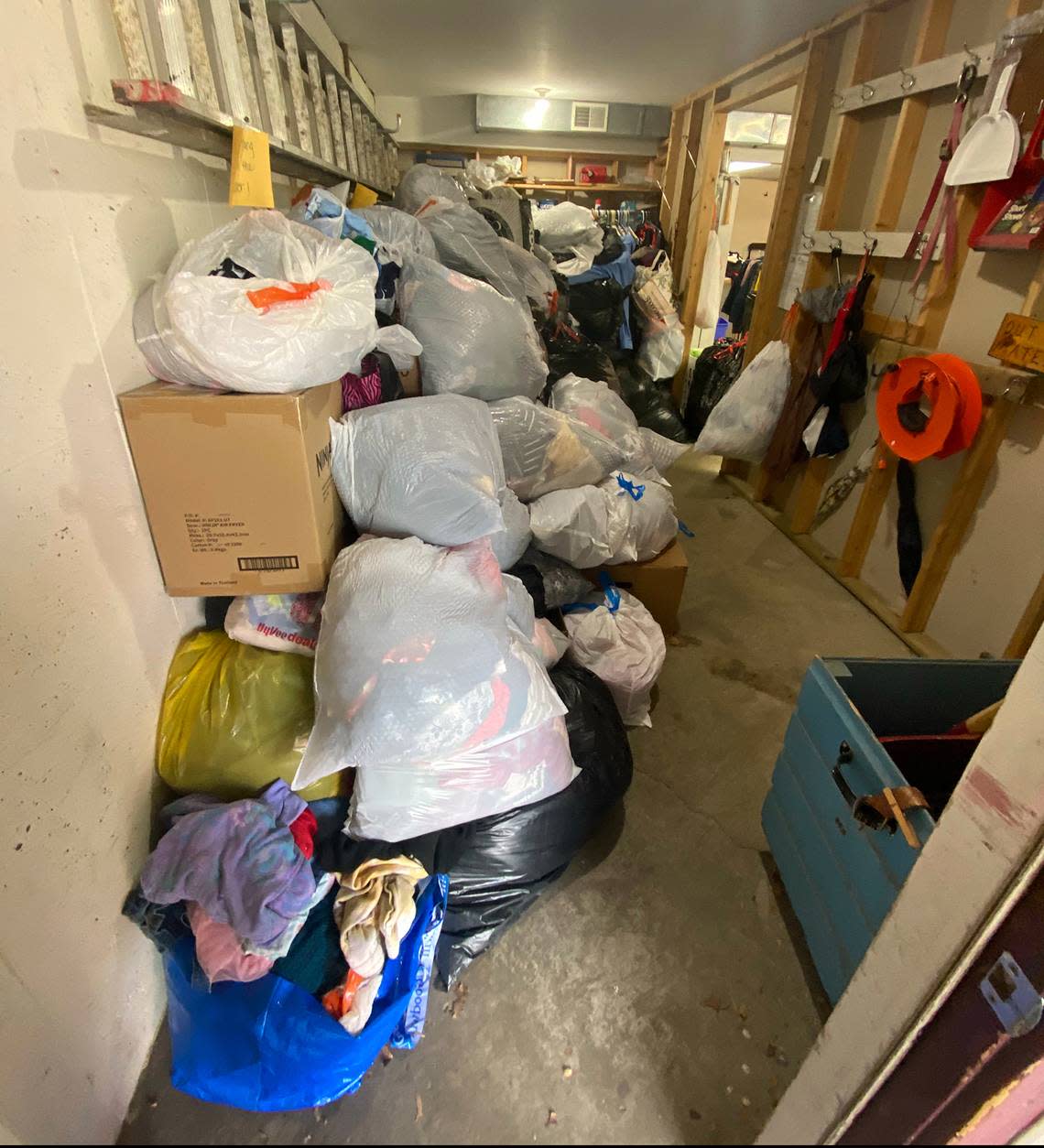 Bags of donated clothes sit in the basement at Northland Clothing Center.
