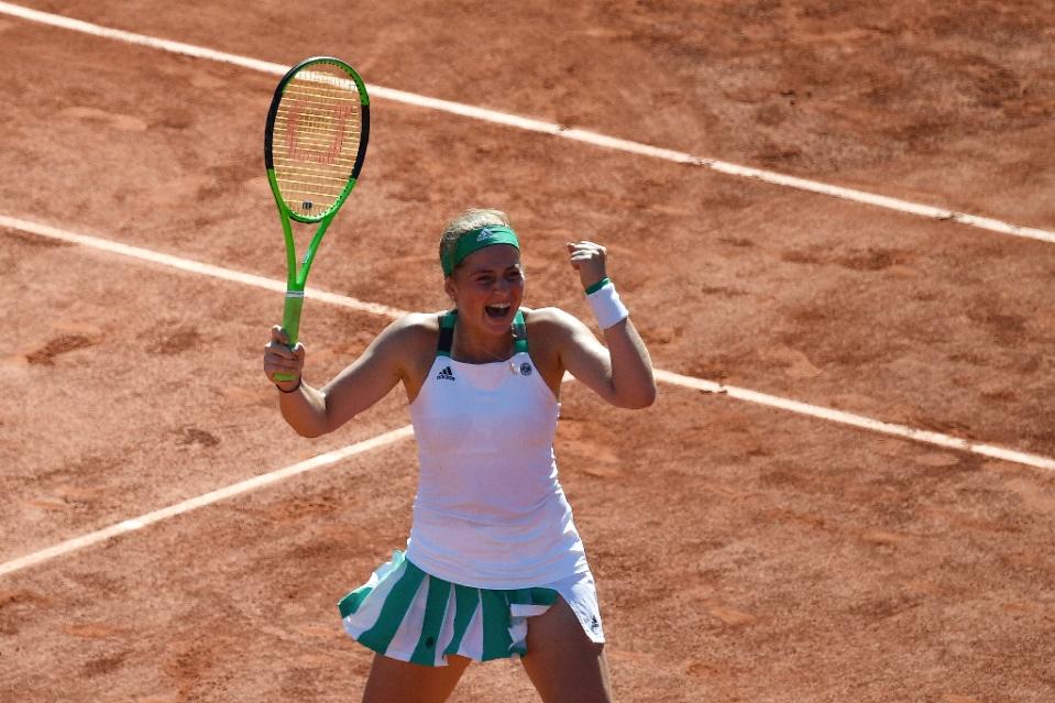 Latvia's Jelena Ostapenko celebrates after winning her semi-final tennis match against Switzerland's Timea Bacsinszky at the French Open 