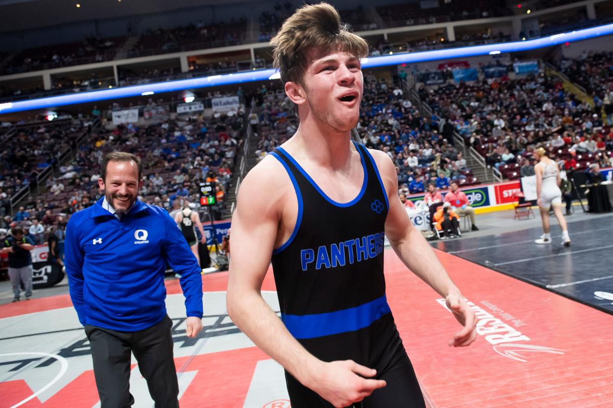Quakertown's Collin Gaj celebrates after defeating Waynesburg's Mac Church in the 145-pound championship bout at the PIAA Class 3A Wrestling Championships at the Giant Center on March 11, 2023, in Hershey. Gaj won by decision, 7-1.