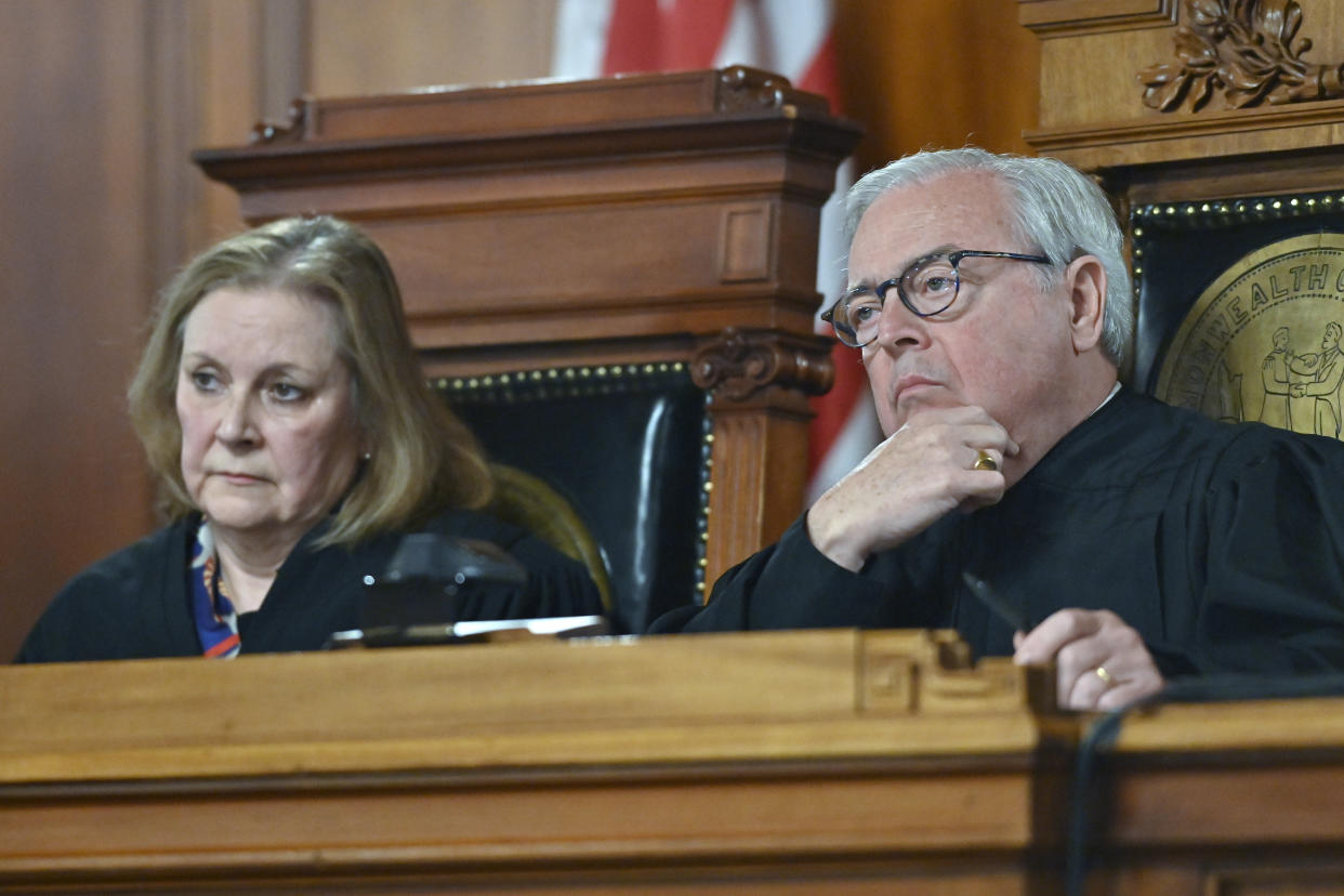 Kentucky Supreme Court Chief Justice John D. Minton Jr., right, and Justice Lisabeth Hughes listen to arguments whether to temporarily pause the state's abortion ban in Frankfort, Ky., Tuesday, Nov. 15, 2022. (AP Photo/Timothy D. Easley)