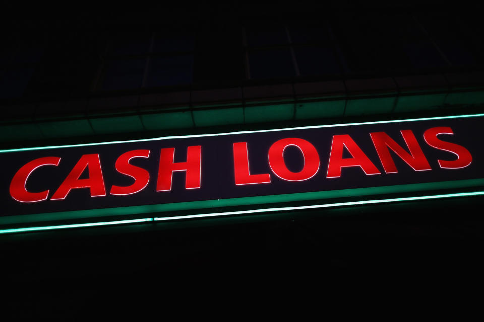 LONDON, ENGLAND - NOVEMBER 01:  A general view of a 'Speedy Cash' cash loans shop on Brixton High Street on November 1, 2012 in London, England. The recession has changed the face of the UK's high streets, which have seen a boom in bookmakers, discount stores, charity shops, cheque cashing (payday loans) and pawnbrokers as cash-strapped Brits struggled with their finances.  (Photo by Dan Kitwood/Getty Images)