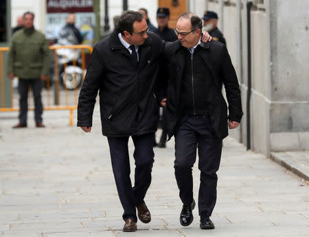 Catalan politicians Josep Rull (L) and Jordi Turull arrive together to the Supreme Court after being summoned and facing investigation for their part in Catalonia's bid for independence in Madrid, Spain, March 23, 2018. REUTERS/Susana Vera