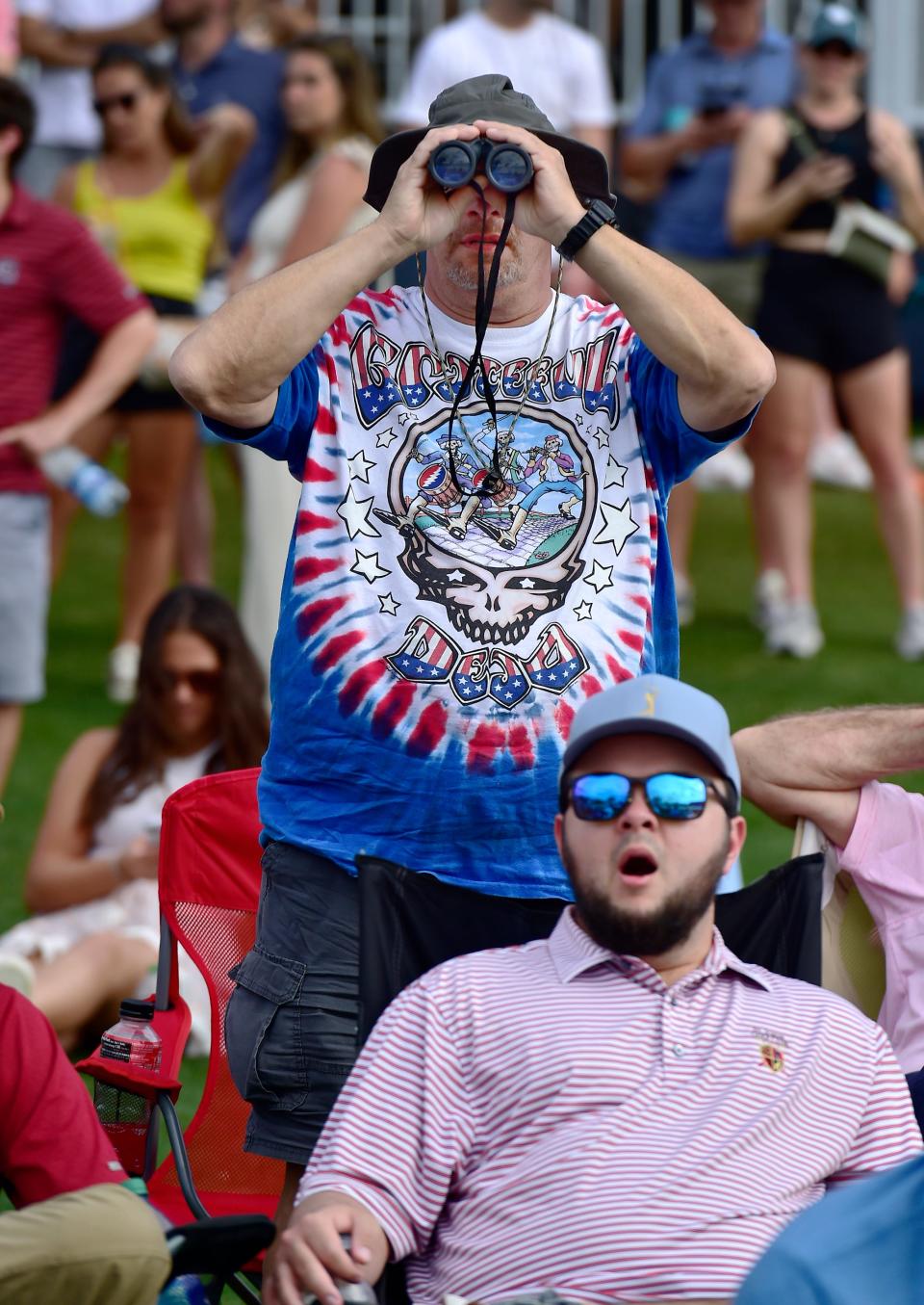 Fans watch the action at the 17th hole of the Players Stadium Course at TPC Sawgrass during the 2023 Players Championship.