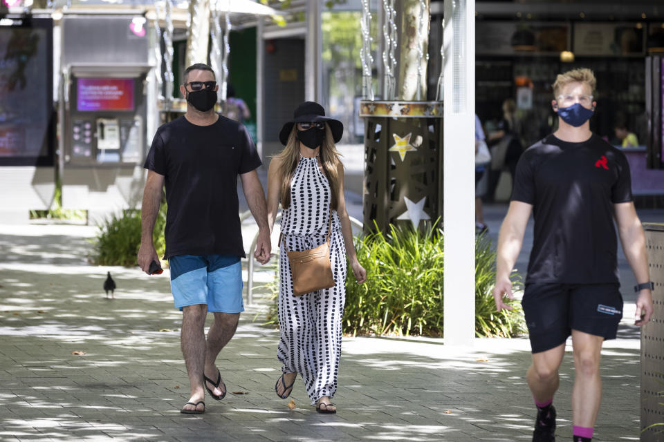 Members of the public are seen wearing face masks on December 24, 2021 in Perth, Australia. 