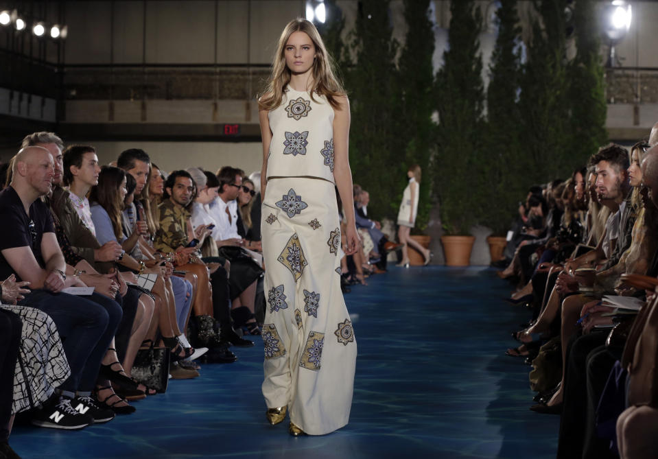 The Tory Burch Spring 2014 collection is modeled during Fashion Week in New York, Tuesday, Sept. 10, 2013. (AP Photo/Richard Drew)