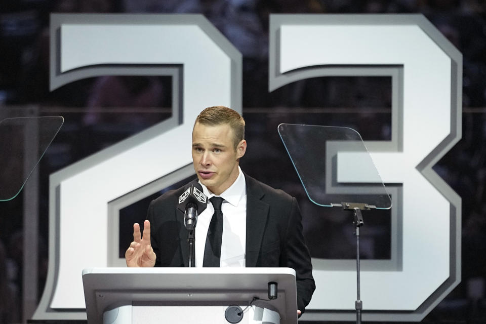 Former Los Angeles Kings right winger Dustin Brown speaks during a ceremony to retire his jersey prior to an NHL hockey game between the Los Angeles Kings and the Pittsburgh Penguins Saturday, Feb. 11, 2023, in Los Angeles. (AP Photo/Mark J. Terrill)