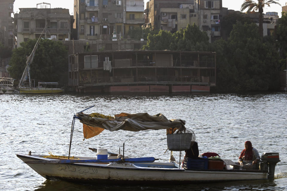 A partially demolished houseboat sits on the banks of the Nile River after being moved from their moorings on July 1, 2022. A government push to remove the string of houseboats from Cairo’s Nile banks has dwindled their numbers from a several dozen to just a handful. The move ends a tradition that dates back to the 1800s, and has drawn criticism in Egypt, where residents are mourning the loss of their homes but also a way of life. The government says it plans to develop the waterfront. (AP Photo/Tarek Wagih)