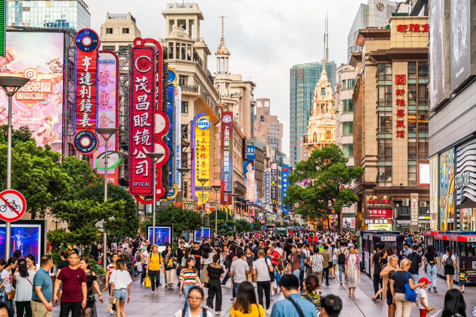 SHANGHAI, CHINA - 2019/07/17: Crowds of  people walk on the East Nanjing road, a famous shopping street in Shanghai. (Photo by Alex Tai/SOPA Images/LightRocket via Getty Images)