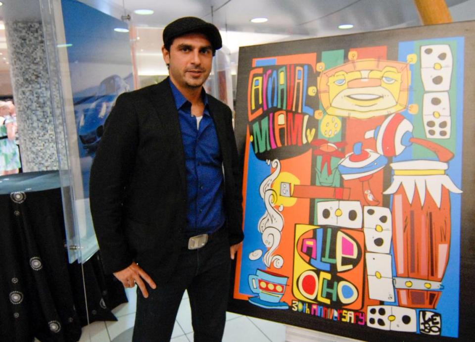 David “LEBO” LeBatard stands next his painting which was commissioned by the Kiwanis of Little Habana to celebrate 30th Anniversary of Carnaval Miami and Calle Ocho open house on February 22, 2008.