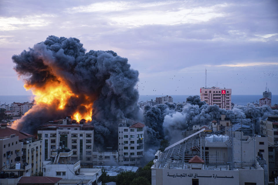 FILE - Fire and smoke rises following an Israeli airstrike, in Gaza City, Saturday, Oct. 7, 2023. Six weeks of fighting since then has seen hundreds of thousands of Palestinians flee to southern Gaza, where they cram into shelters and take refuge with friends and family. (AP Photo/Fatima Shbair, File)