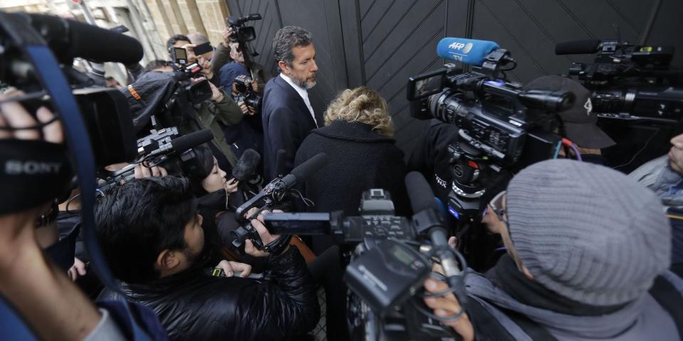 Journalists gather around unidentified visitors arriving to a house referenced by court documents as belonging to former Nissan chief Carlos Ghosn in the Lebanese capital Beirut, on January 2, 2020. - Lebanese lawyers filed today a report to the judiciary demanding fugitive auto tycoon Carlos Ghosn be prosecuted over a trip he made to Israel as Renault-Nissan chairman in 2008, after he jumped bail in Tokyo in mysterious circumstances and arrived in his native Lebanon early on December 30. (Photo by JOSEPH EID / AFP) (Photo by JOSEPH EID/AFP via Getty Images)