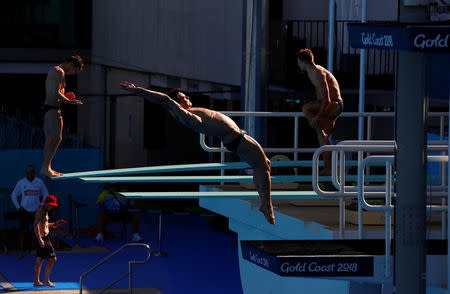 Britain's Tom Daley dives during a team training session ahead of the Commonwealth Games on the Gold Coast in Australia, April 3, 2018. REUTERS/David Gray