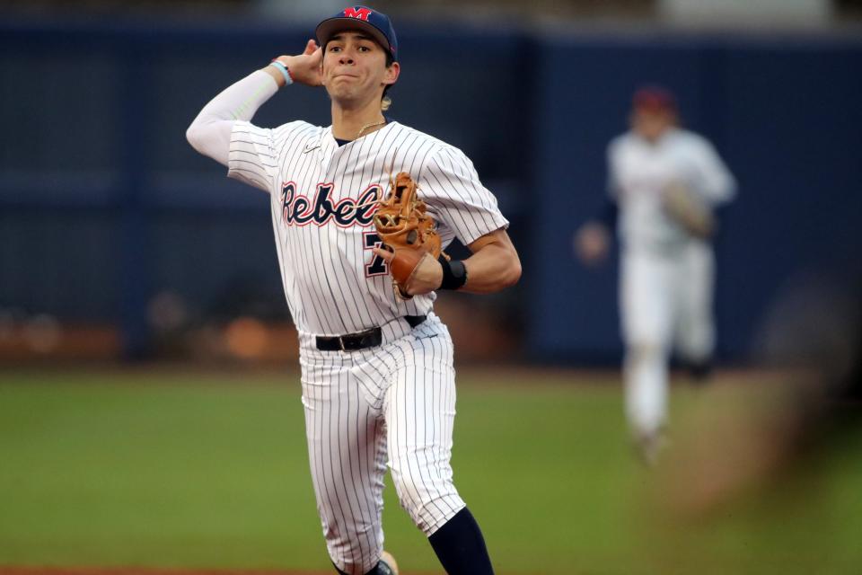 Ole Miss shortstop Jacob Gonzalez fields and throws in the Rebels' win over VCU on Friday, February 25, 2022.