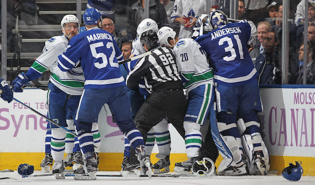 TORONTO, ON - NOVEMBER 5: Frederik Andersen #31 of the Toronto Maple Leafs leaves his crease to join in a fight against Ryan Miller #30 of the Vancouver Canucks during an NHL game at the Air Canada Centre on November 5, 2016 in Toronto, Ontario, Canada. The Leafs defeated the Canucks 6-3. (Photo by Claus Andersen/Getty Images)