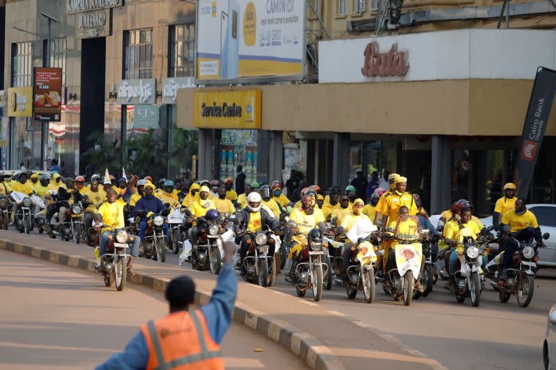 Supporters of Uganda's President Yoweri Museveni drive their motorcycles and celebrate the announcement of him winning the presidential elections, in Kampala