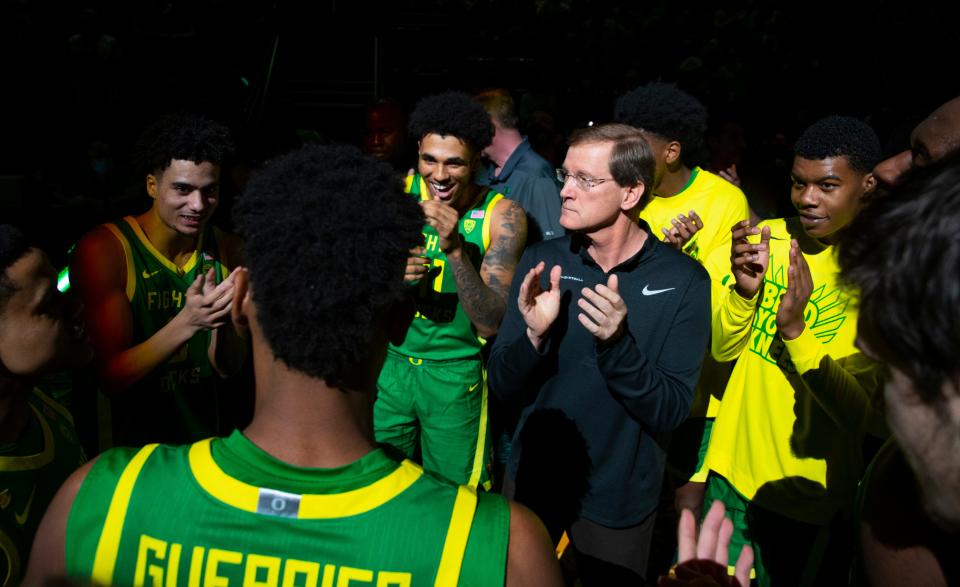 Oregon players and coach Dana Altman gather on the court before their game against Oregon State Jan. 29, 2022.