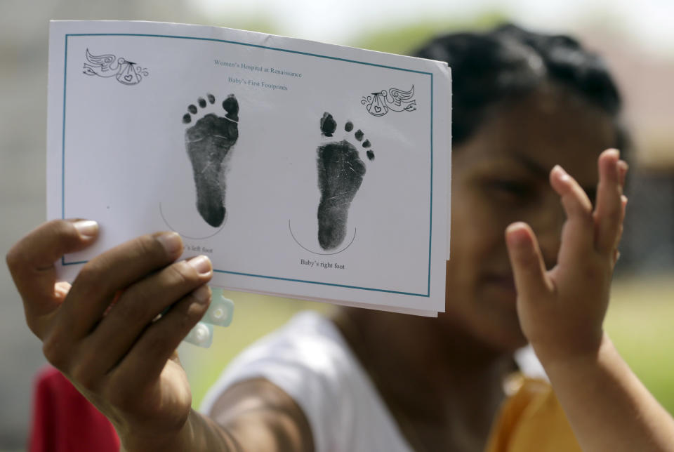 A woman in Sullivan City, Texas, who said she entered the country illegally shows the footprints of her daughter, who was born in the United States but was denied a birth certificate, on Sept. 16, 2015. (Photo: Eric Gay/AP)