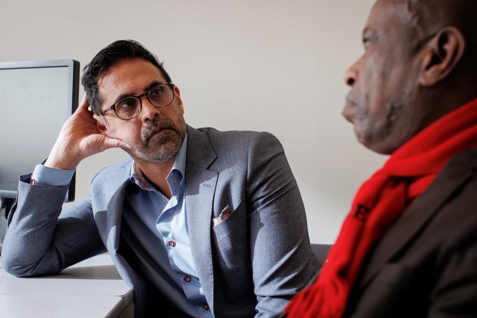 Lawyer Subodh Bharati reacts to a statement by Abdirahaman Warssama, who fled Somalia in 1989 and spent 5 years and 7 months in a Canadian prison as an immigration detainee, in his office on the campus of York University, in Toronto, on Jan. 18, 2023.