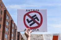 <p>A counter protester holds a sign with the words “Antifa” (anti-fascists) outside of the Boston Commons and the Boston Free Speech Rally in Boston, Mass., Aug. 19, 2017. (Photo: Stephanie Keith/Reuters) </p>