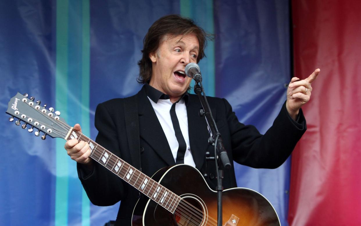 The Beatles star is said to have rang up the Queen guitarist for advice ahead of his headline performance at the world famous venue next year - PA