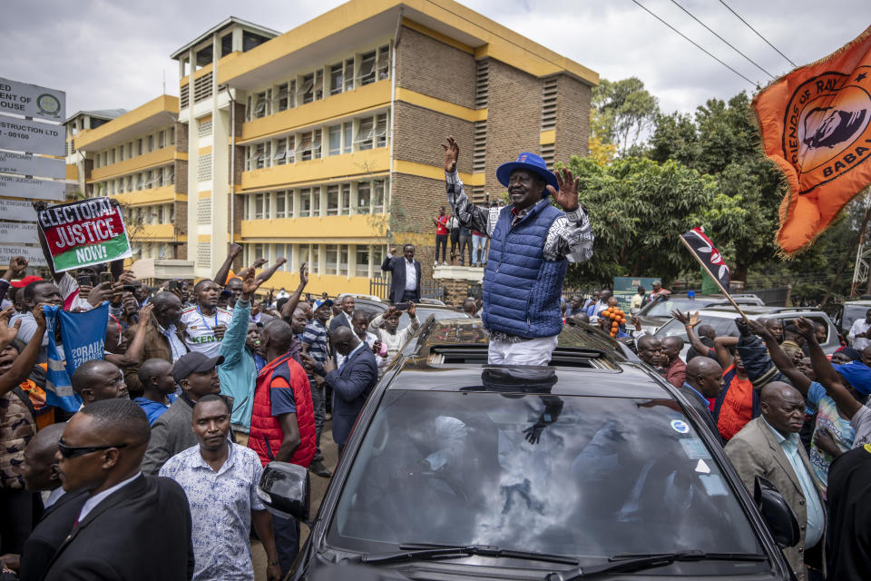 Presidential candidate Raila Odinga waves to supporters as he leaves the Supreme Court in Nairobi, Kenya Monday, Aug. 22, 2022. Odinga filed a Supreme Court challenge to last week's election result, asserting that the process was marked by criminal subversion and seeking that the outcome be nullified and a new vote be ordered. (AP Photo/Ben Curtis)