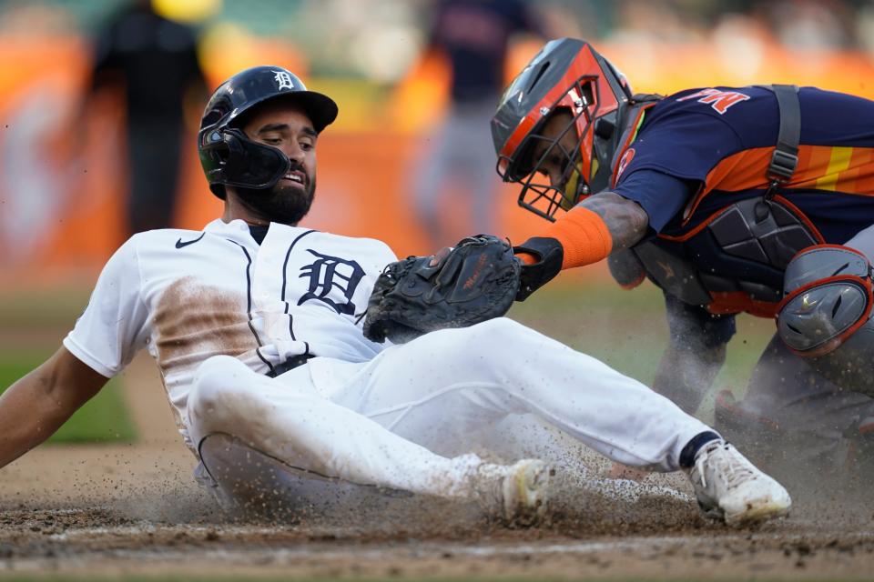 Houston Astros catcher Martin Maldonado, right, tags Detroit Tigers center fielder Riley Greene out at home plate in the first inning of a baseball game in Detroit, Monday, Sept. 12, 2022.