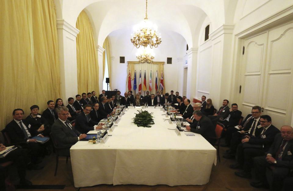 The European Union's political director Helga Schmid and Iran's deputy Foreign Minister Abbas Araghchi, from left, wait for a bilateral meeting as part of the closed-door nuclear talks with Iran in Vienna, Austria, Wednesday, Feb. 26, 2020. (AP Photo/Roland Zak)