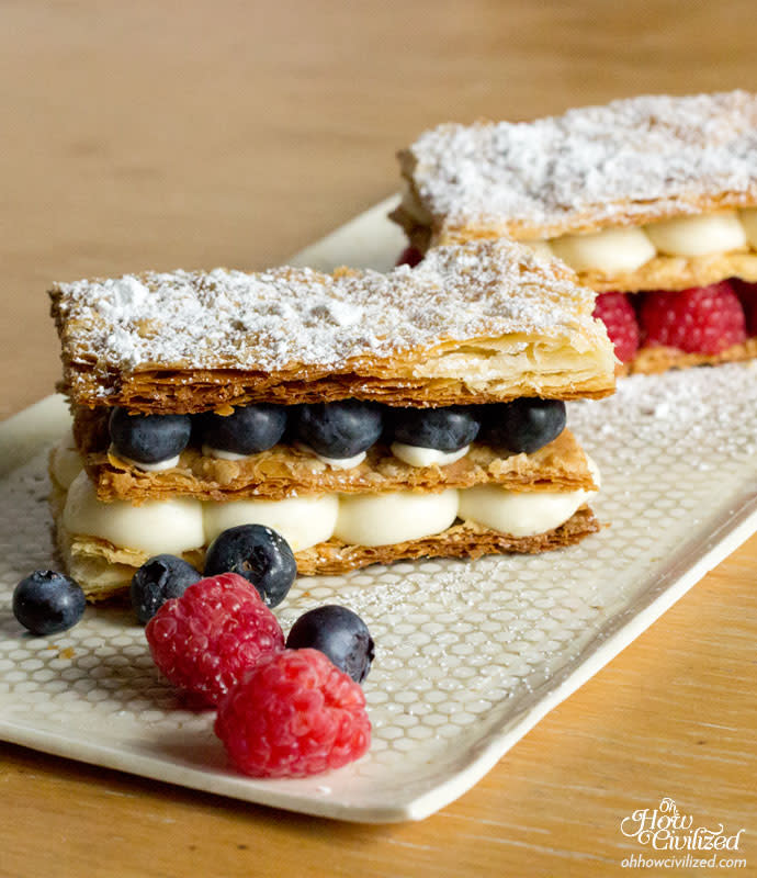 <p>Oh How Civilized</p><p>This yuzu and berry mille feuille is light and rich all at the same time with a touch of spring and summer with yuzu (Japanese citrus fruit) and berries.</p><p><strong>Get the recipe: <a href="https://www.ohhowcivilized.com/step-by-step-recipe-yuzu-berry-mille-feuille/" rel="nofollow noopener" target="_blank" data-ylk="slk:Yuzu Berry Mille Feuille;elm:context_link;itc:0;sec:content-canvas" class="link "><em>Yuzu Berry Mille Feuille</em></a></strong></p>