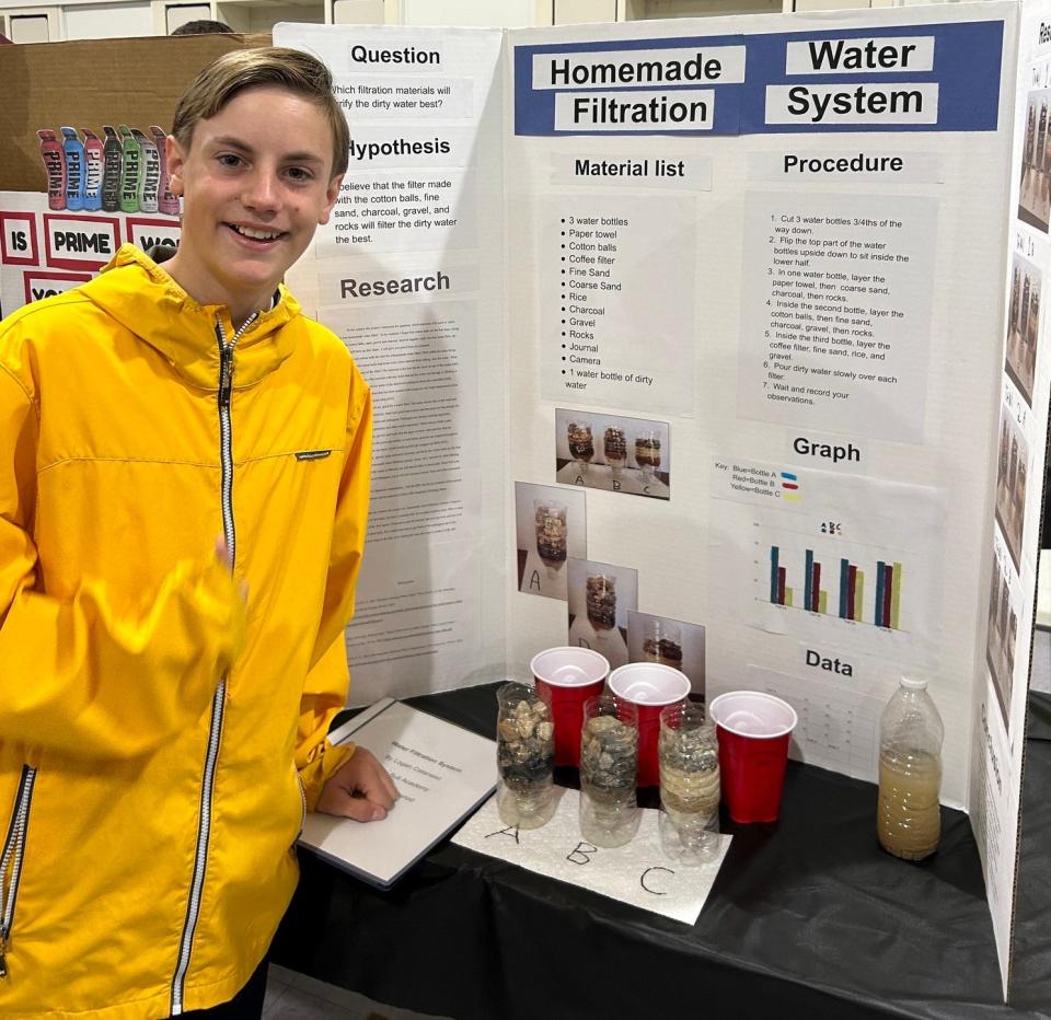 Seventh grader Logan Cataneso, shown here, took home the first place Top Water Award with his project titled, “Homemade Water Filtration System" while sixth grader Natalie Mendoza won the second place award with her project called “Safe Water.”