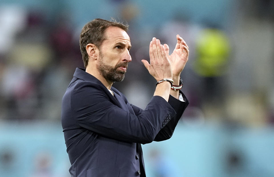 England's head coach Gareth Southgate claps hands after the World Cup group B soccer match between England and Iran at the Khalifa International Stadium in in Doha, Qatar, Monday, Nov. 21, 2022. (AP Photo/Martin Meissner)