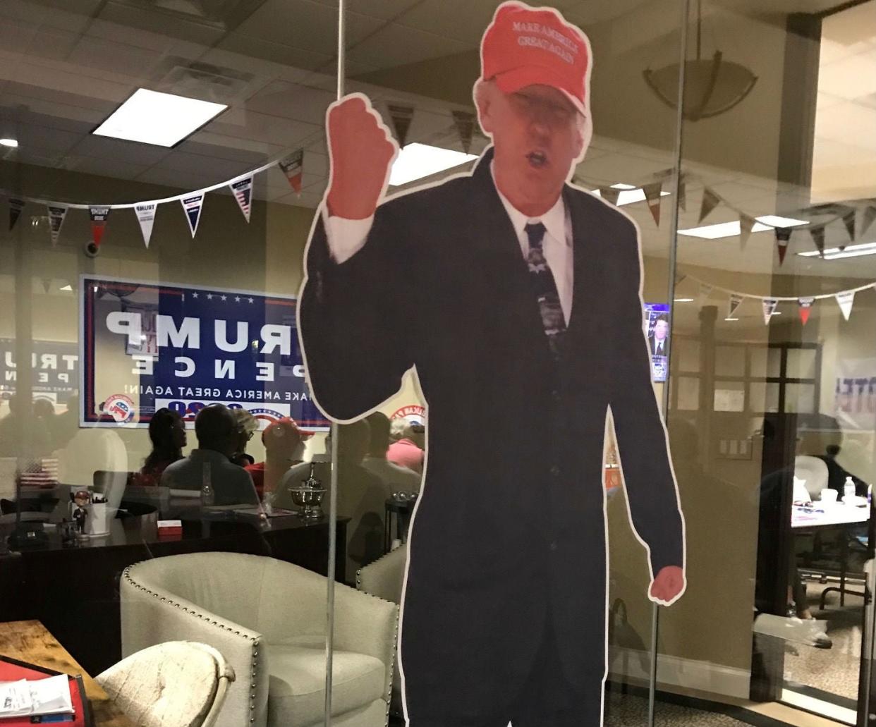 Two cuts outs of president watched over debate in Daytona Beach (Andrew Buncombe)