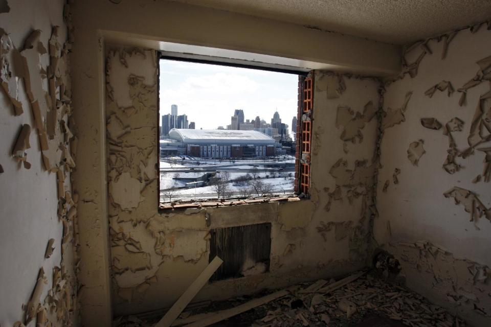 FILE - In this photo taken Feb. 18, 2010, downtown Detroit and Ford Field are seen from a window at the Brewster-Douglass Housing Projects in Detroit, where singers Diana Ross and the Supremes lived before becoming Motown singing superstars. Mayor Dave Bing has called a news conference for Thursday, Nov. 15, 2012, to announce plans for the projects, which Bing said in his March State of the City address that he wanted to demolish this year. (AP Photo/Carlos Osorio, file)