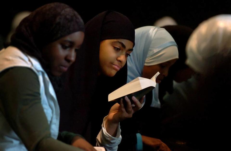 Nafisah Wright, an 11th grader at Charlotte Islamic Academy reads the Koran in this 2007 file photo.