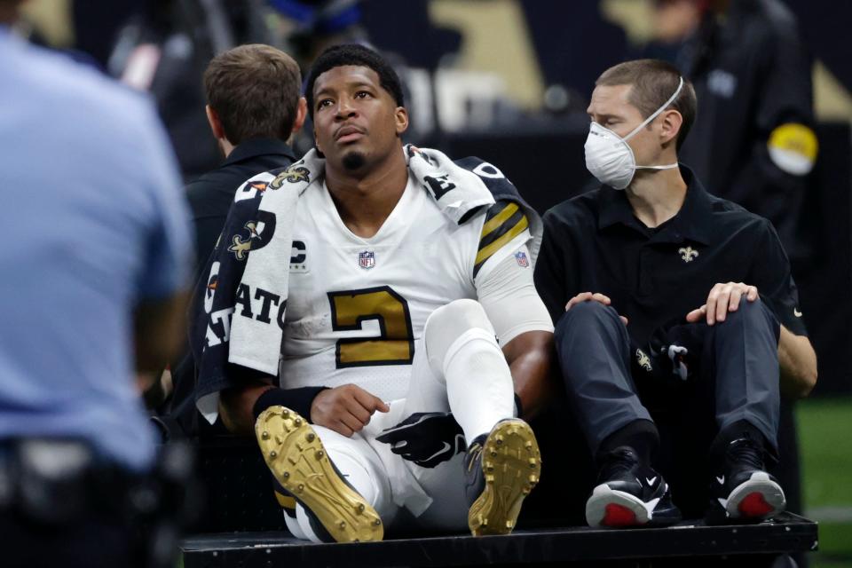 New Orleans Saints quarterback Jameis Winston (2) is carted off the field after being injured from a horse collar tackle in the first half of an NFL football game against the Tampa Bay Buccaneers in New Orleans, Sunday, Oct. 31, 2021.