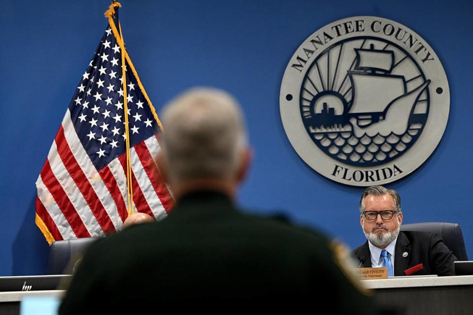 Commissioner and Chair Mike Rahn listens as Sheriff Rick Wells presents during a special Manatee County Commission meeting Tuesday, April 16, 2024 on the impacts of illegal immigration in the county.