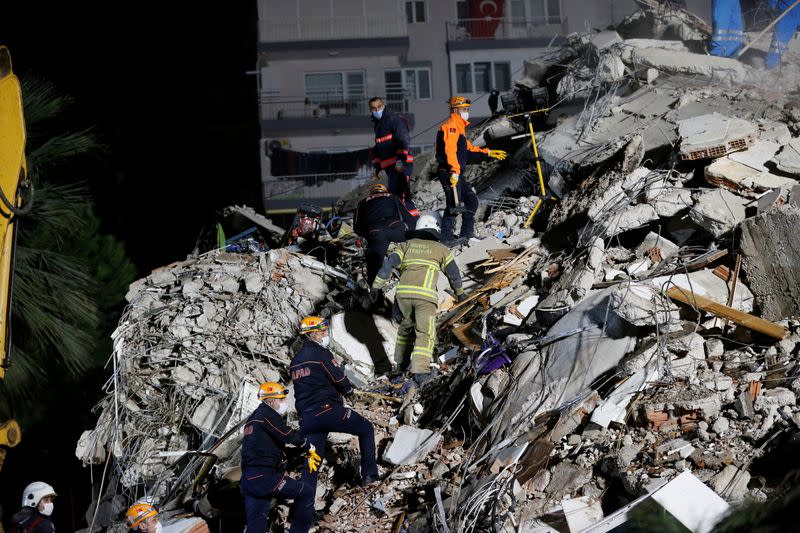 Rescue operations take place on a site after an earthquake struck the Aegean Sea, in the coastal province of Izmir