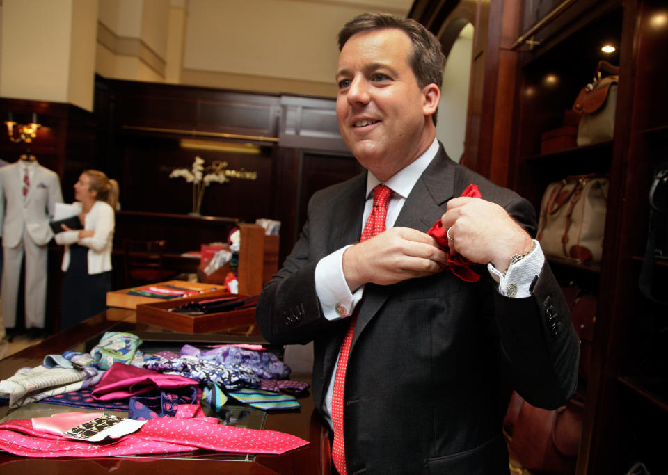 This June 18, 2012 photo shows Ed Henry, chief White House correspondent on the Fox News Channel, adjusts his pocket square at the Brooks Brothers flagship store in New York. Henry's pocket square flair all started as a friendly fashion competition with a former colleague. It was all about the bigger, better necktie back then, Henry says. There was an unending game of one-upmanship with more colorful shirts, perhaps even a pattered vest. Going around the globe, Henry says he picks up ties and pocket squares as souvenirs, and they act as a bit of a travelogue. (AP Photo/Richard Drew)