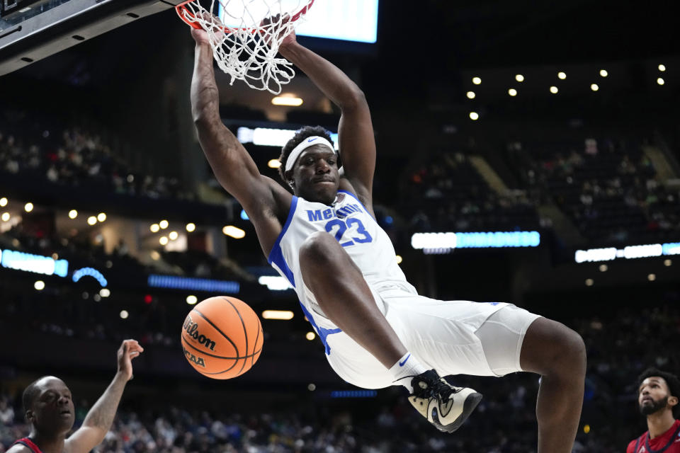 Memphis Tigers forward Malcolm Dandridge (23) dunks against Florida Atlantic in the second half of a first-round college basketball game in the NCAA Tournament Friday, March 17, 2023, in Columbus, Ohio. (AP Photo/Paul Sancya)