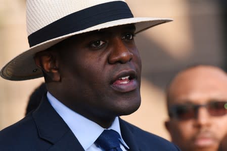 Dr. Michael Waters from the Joy Tabernacle A.M.E. Church speaks at the prayer vigil held outside the Frank Crowley Courts Building on the first day of the trial against former police officer Amber Guyger in Dallas