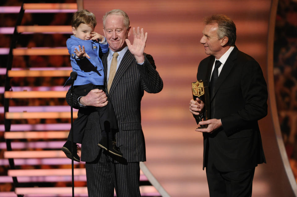 Former NFL quartetrback Joe Montana, right, presents the award for AP Most Valuable Player to Archie Manning and Marshall Manning, on behalf of Denver Broncos quarterback Peyton Manning, son of Archie Manning, at the third annual NFL Honors at Radio City Music Hall on Saturday, Feb. 1, 2014, in New York. (Photo by Evan Agostini/Invision for NFL/AP Images)