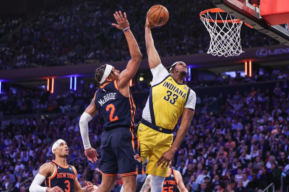 May 8, 2024; New York, New York, USA; Indiana Pacers center Myles Turner (33) drives past New York Knicks guard Miles McBride (2) for a dunk in the second quarter during game two of the second round for the 2024 NBA playoffs at Madison Square Garden. Mandatory Credit: Wendell Cruz-USA TODAY Sports