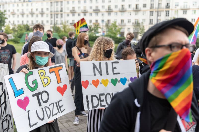 Members of a group supporting LGBT rights protest in Warsaw