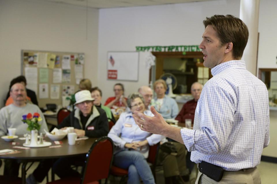 In this March 12, 2014 photo tea party-backed Nebraska Republican Senate candidate Ben Sasse campaigns in Elmwood, Neb. The heavy outside influence in Nebraska's race between Sasse and GOP-backed Shane Osborn is a change from previous elections, when party leaders largely left the choice to voters. But the ugly jousting in Congress between party powerbrokers and right-wing insurgents, and the party’s losses in 2012, ended that practice. (AP Photo/Nati Harnik)