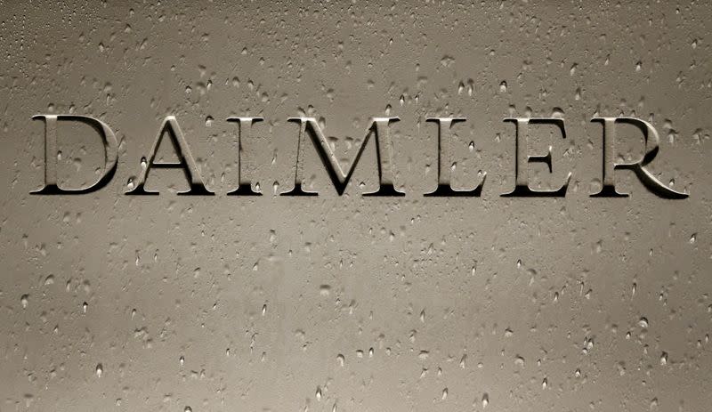 FILE PHOTO: Daimler AG sign with raindrops is pictured before the company's 2016 annual news conference in Stuttgart