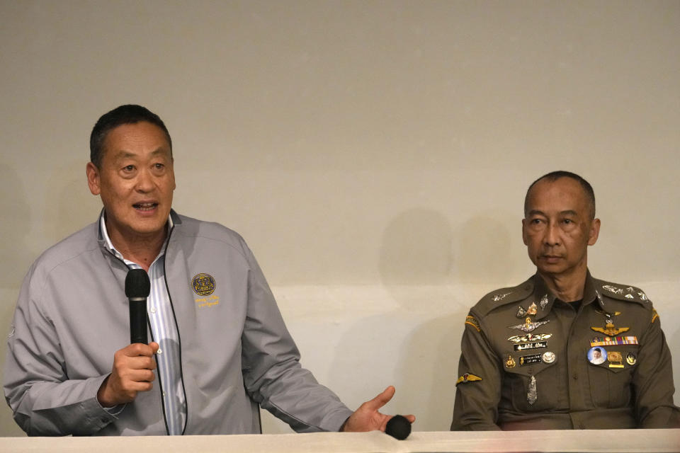 Thai Prime Minister Srettha Thavisin, left, speaks to the media as Royal Thai Police Chief Torsak Sukvimol listens during a press conference at Grand Hyatt Erawan Hotel in Bangkok, Thailand, Tuesday, July 16, 2024. Police said a number of people were found dead Tuesday in the luxury hotel in downtown Bangkok and poisoning is suspected. (AP Photo/Sakchai Lalit)