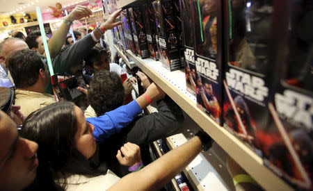 FILE PHOTO - Customers pick new toys from the upcoming film "Star Wars: The Force Awakens" on "Force Friday" in Sao Paulo, Brazil, September 4, 2015. REUTERS/Paulo Whitaker/File Photo