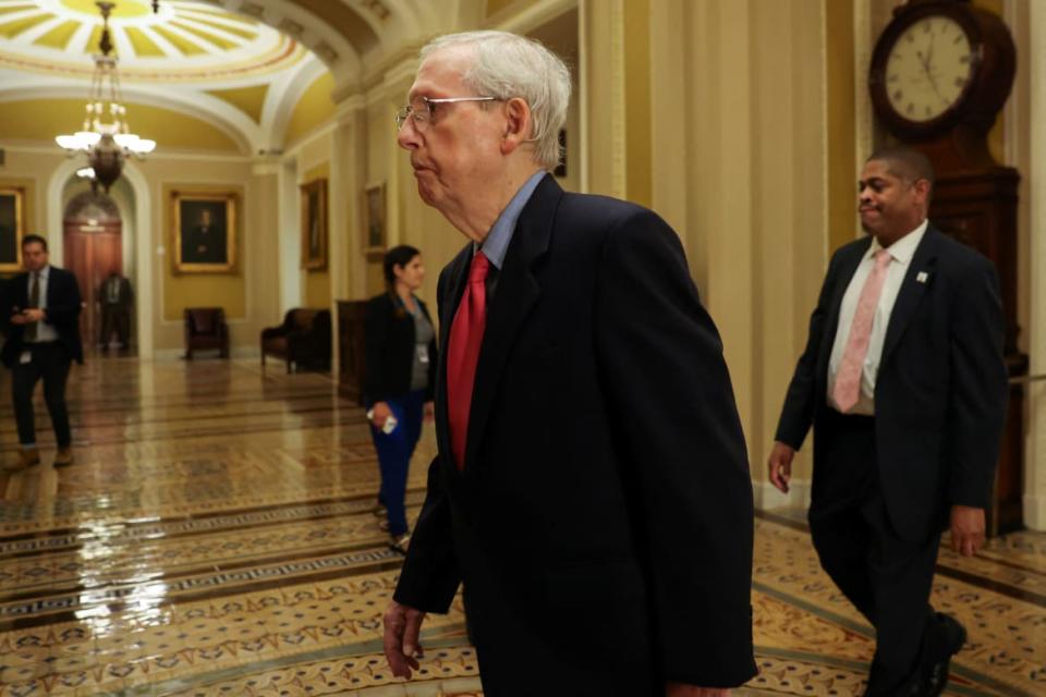 Senate Minority Leader Mitch McConnell (R-KY) walks to the Senate floor amid ongoing talks over government funding, as the threat of an October government shutdown looms on Capitol Hill