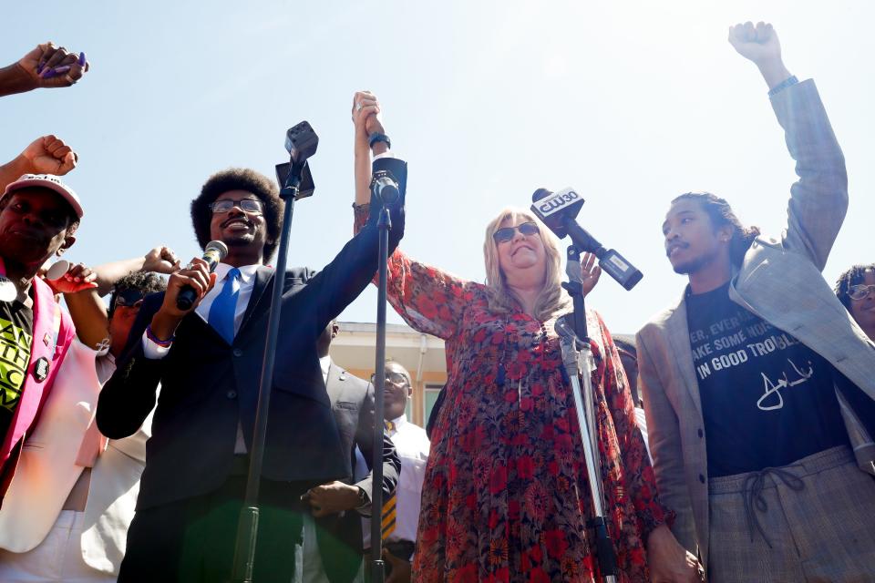 Democratic state Reps. Justin Pearson of Memphis, Gloria Johnson of Knoxville and Justin Jones of Nashville speak before marching to the Shelby County Board of Commissioners meeting in Memphis on April 12. Pearson was reinstated to his position in the Tennessee House of Representatives