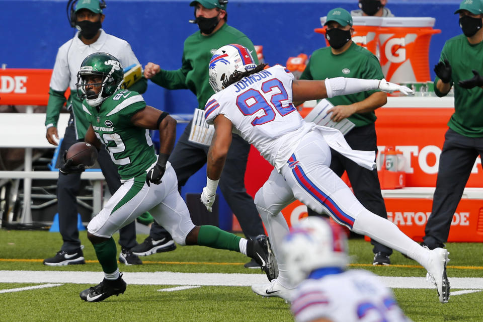 New York Jets wide receiver Jamison Crowder (82) gets past Buffalo Bills defensive end Darryl Johnson (92) after taking a pass from quarterback Sam Darnold and scoring during the second half of an NFL football game in Orchard Park, N.Y., Sunday, Sept. 13, 2020. (AP Photo/Jeffrey T. Barnes)