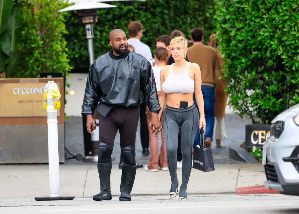 Not to Ced’s taste: Ye sports tight pants and high boots in L.A.. Strolling with Ye is his Australian partner, Bianca Censori, on May 13, 2023. (Credit: Rachpoot/Bauer-Griffin/GC Images via Getty Images)